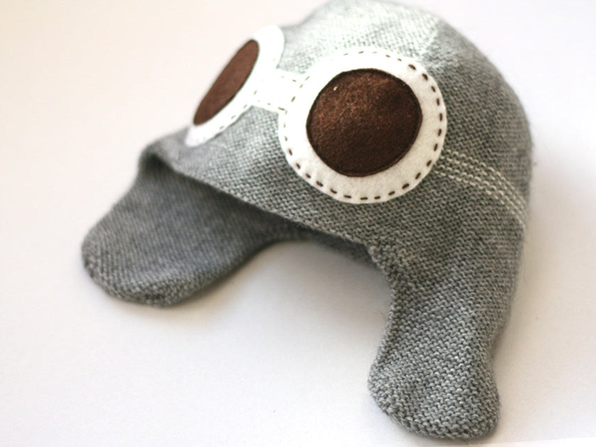 knitted aviator hat in grey color with white felted goggles